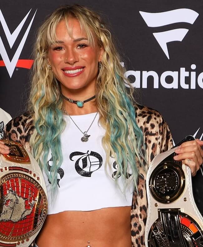 Promotional graphic of WWE NXT star Sol Ruca holding the North American and Speed Championship titles in 2025